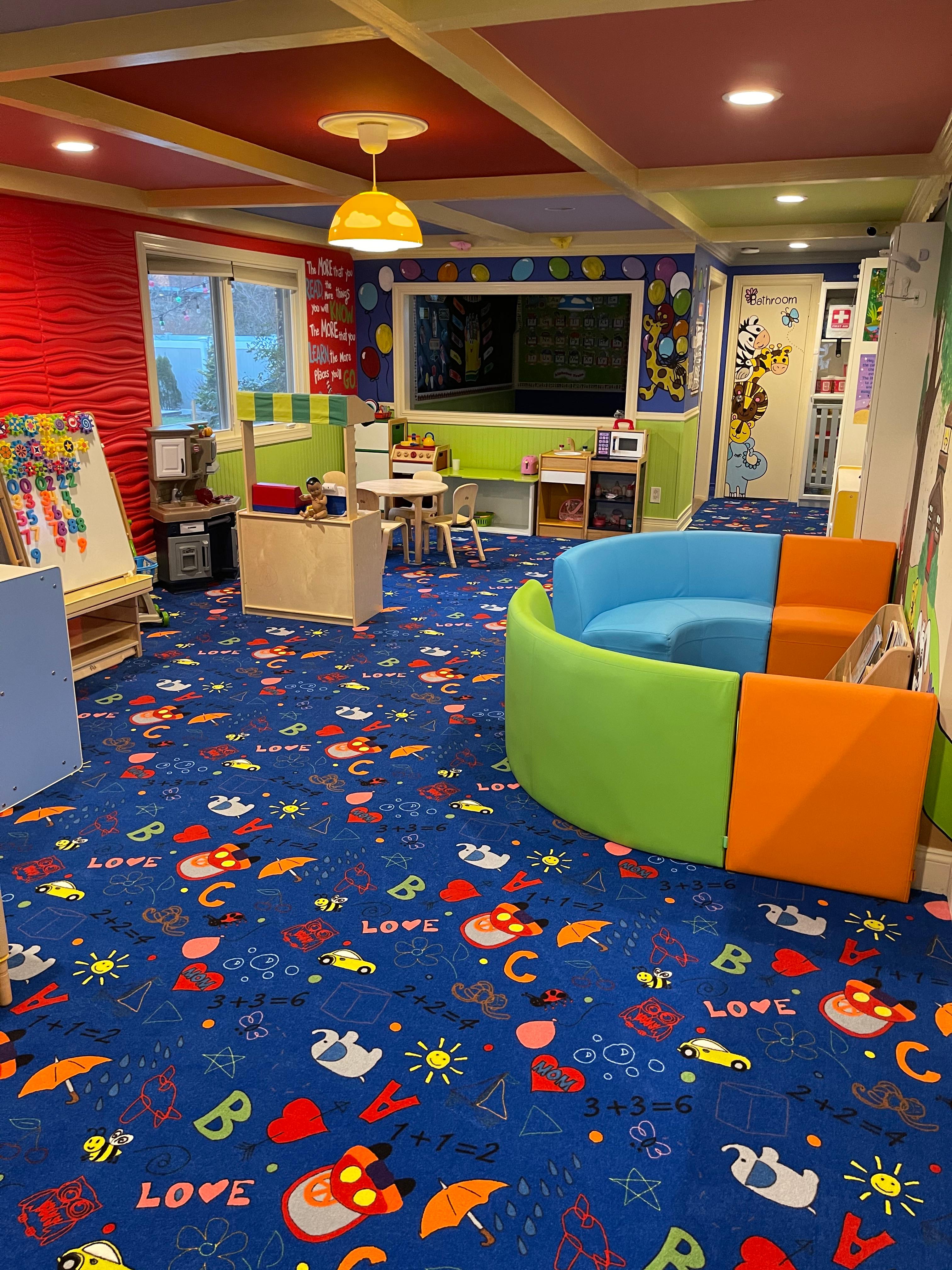 Activity classroom with learning easel and colorful ceiling